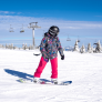 girl-learning-snowboard-mountain-resort-with-ski-lift-background
